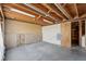 Unfinished basement with concrete floor and exposed ceiling, offering potential for customization at 831 Sable Blvd, Aurora, CO 80011
