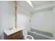 Bathroom with a single vanity, toilet, and bathtub, ready for renovation at 831 Sable Blvd, Aurora, CO 80011