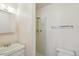 A small bathroom featuring a shower with a shower head and a single sink vanity at 831 Sable Blvd, Aurora, CO 80011