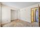 Bedroom with a closet and doorway, ready to be renovated at 831 Sable Blvd, Aurora, CO 80011