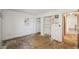 A bedroom with bare floors, an open closet, and a doorway at 831 Sable Blvd, Aurora, CO 80011