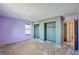 A bedroom with bare floors, two closets, and a window providing natural light at 831 Sable Blvd, Aurora, CO 80011
