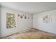 A bedroom with bare floors and a window providing natural light at 831 Sable Blvd, Aurora, CO 80011