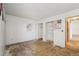 Bedroom featuring a closet and damaged flooring ready to be renovated at 831 Sable Blvd, Aurora, CO 80011