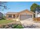 Charming home featuring a two-car garage and a well-maintained front yard at 831 Sable Blvd, Aurora, CO 80011