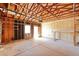Unfinished garage with concrete floors, high ceilings, and natural light offers potential for versatile usage at 831 Sable Blvd, Aurora, CO 80011