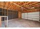 Spacious unfinished garage with high ceilings and ample room for parking and storage at 831 Sable Blvd, Aurora, CO 80011