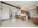 Open kitchen with a dining area, laminate flooring, and a view into the adjacent living room at 831 Sable Blvd, Aurora, CO 80011