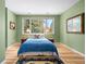 Tranquil bedroom with a large window and elegant decor at 5575 Jackpine Rd, Evergreen, CO 80439