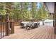 Outdoor deck area showcasing stylish furniture, perfect for relaxation and entertaining at 5575 Jackpine Rd, Evergreen, CO 80439