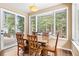 This dining room features a large window with a view of the outdoors and plenty of seating at 5575 Jackpine Rd, Evergreen, CO 80439