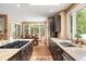 This kitchen features granite countertops, stainless appliances and a view into the trees at 5575 Jackpine Rd, Evergreen, CO 80439