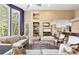 Inviting living room with fireplace, hardwood floors, and an open layout, creating a cozy yet spacious atmosphere at 5575 Jackpine Rd, Evergreen, CO 80439