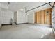 Unfinished two car garage with stairs to interior of home at 7360 Watercress Dr, Littleton, CO 80125