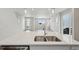 Contemporary kitchen featuring stainless steel sink, island, and seamless flow to living area at 7360 Watercress Dr, Littleton, CO 80125