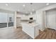 Modern kitchen featuring white cabinets, stainless steel appliances, and an island at 7360 Watercress Dr, Littleton, CO 80125