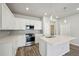 Well-equipped kitchen with stainless steel appliances, ample counter space, and modern lighting at 7360 Watercress Dr, Littleton, CO 80125