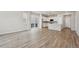 Open-concept living room with modern finishes and seamless access to the kitchen at 7360 Watercress Dr, Littleton, CO 80125