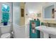 Cozy bathroom featuring beadboard walls, a pedestal sink, and decorative touches at 310 Judson St, Longmont, CO 80501