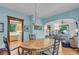Bright dining room showcasing an archway to a living room and hardwood floors at 310 Judson St, Longmont, CO 80501