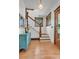 Welcoming entryway with hardwood floors, stairs, and decorative accents at 310 Judson St, Longmont, CO 80501