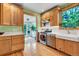 Lovely kitchen showcases light wood cabinets, stainless steel appliances, and natural lighting at 310 Judson St, Longmont, CO 80501