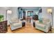 Inviting living room featuring hardwood floors, cozy chairs, and natural light at 310 Judson St, Longmont, CO 80501