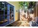 Side yard featuring a private patio area with seating and a wooden fence at 310 Judson St, Longmont, CO 80501