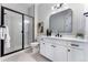 Bright bathroom features a glass-enclosed shower, contemporary vanity, and modern finishes at 3394 Backdrop Ct, Castle Rock, CO 80108