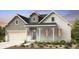 Charming two-story home with a brick and gray siding exterior and a two-car garage at 3394 Backdrop Ct, Castle Rock, CO 80108