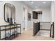 Elegant foyer with a wooden console table, decorative vases, and a view of the staircase at 3394 Backdrop Ct, Castle Rock, CO 80108