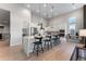 Bright kitchen with a large island, modern appliances, and white cabinetry at 3394 Backdrop Ct, Castle Rock, CO 80108