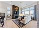 Bright living room with a cozy fireplace, large windows, and comfortable seating at 3394 Backdrop Ct, Castle Rock, CO 80108