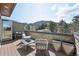 Mountain view seen from an inviting balcony with a stone wall and contemporary outdoor furniture at 350 15Th St, Boulder, CO 80302