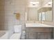 Modern bathroom featuring a toilet, vanity with a sink, mirror and shower with glass door at 350 15Th St, Boulder, CO 80302