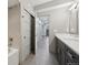 Well-lit bathroom featuring a tub and shower combo, a double vanity, and modern fixtures at 350 15Th St, Boulder, CO 80302