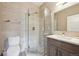 Modern bathroom with shower, glass door, pebble floor, tile walls, toilet and sink at 350 15Th St, Boulder, CO 80302