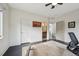 A sunny bedroom has dark hardwood floors, white walls, and an adjacent bathroom at 350 15Th St, Boulder, CO 80302