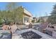 Backyard fire pit with Adirondack chairs, complemented by gravel and stone landscaping at 350 15Th St, Boulder, CO 80302