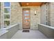 Inviting front entry featuring a sleek wood door with glass panels and stone surround at 350 15Th St, Boulder, CO 80302