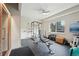 A home gym with a weight rack, free weights, and rubber flooring, and a window at 350 15Th St, Boulder, CO 80302