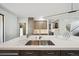 Bright kitchen showcasing a stainless steel sink, quartz countertops, and modern lighting fixtures at 350 15Th St, Boulder, CO 80302