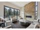 Spacious living area with a stone fireplace, modern lighting, and large windows with outdoor views at 350 15Th St, Boulder, CO 80302