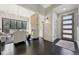 Bright living room featuring dark hardwood floors, a stone fireplace, and ample seating at 350 15Th St, Boulder, CO 80302