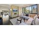 Cozy living room with stone fireplace, modern decor, and large windows offering beautiful views at 350 15Th St, Boulder, CO 80302