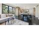 Open-concept living area with a modern sofa, dining area, and large windows at 350 15Th St, Boulder, CO 80302