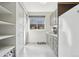 Bright pantry with tile floor, built in shelves, white cabinets and lots of storage at 350 15Th St, Boulder, CO 80302