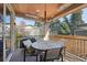 Outdoor patio features a dining table, grill, and wood ceiling perfect for outdoor entertaining at 350 15Th St, Boulder, CO 80302