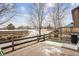 Inviting backyard with a brick patio, bordered by a rustic wooden fence, creating a peaceful outdoor space at 371 Smith Cir, Erie, CO 80516