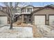 Charming townhome with a private garage and well-maintained front yard at 371 Smith Cir, Erie, CO 80516